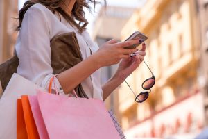Woman Shopping looking at phone