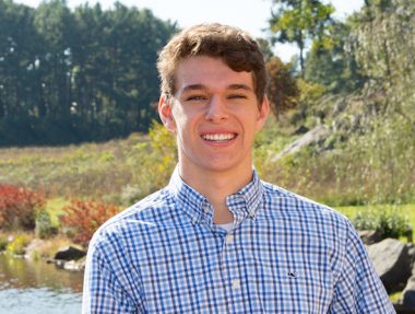 young man posing for senior portrait